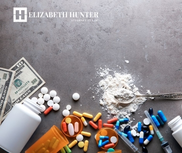 drugs and cash on a concrete table