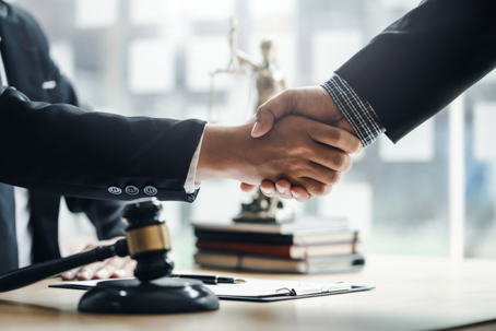 Client shaking hands with lawyer