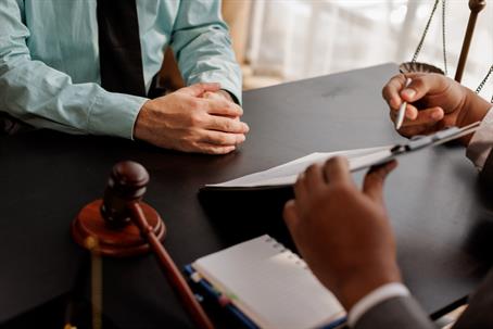 Lawyer reviewing documents with client