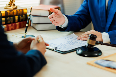 Lawyer reviewing documents with client