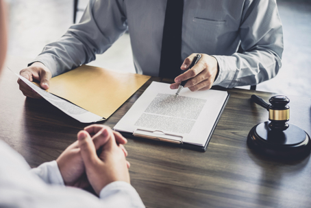 Attorney reviewing documents with client